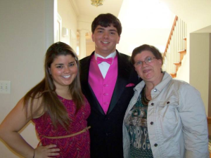 Athena, her brother Mike and mother Cathy posing before Mike's prom